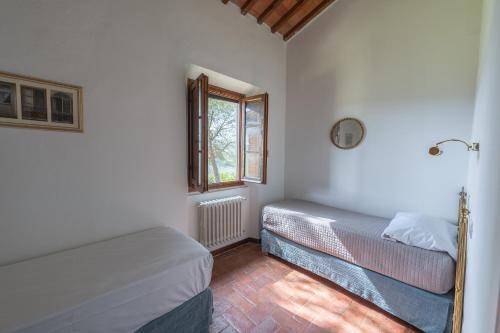 Postel nebo postele na pokoji v ubytování Corte Di Valle