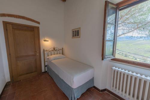 Postel nebo postele na pokoji v ubytování Corte Di Valle