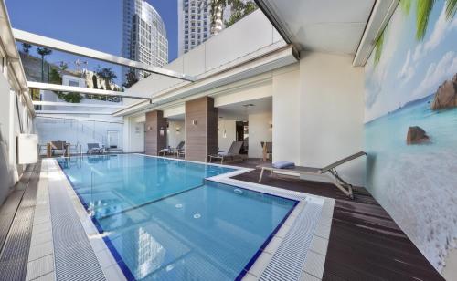 an indoor swimming pool in a building at Fraser Place Anthill Istanbul in Istanbul