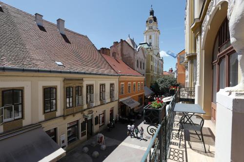 an overhead view of a city street with buildings at Palatinus Grand Hotel in Pécs