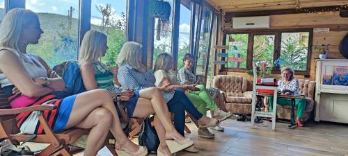 a group of women sitting in chairs in a room at ZeLLin House of Inspiration in Botevgrad