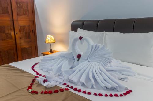 Ένα ή περισσότερα κρεβάτια σε δωμάτιο στο Amed Permai Home Stay
