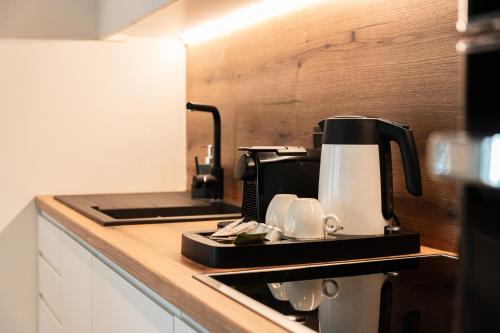 a coffee maker on a counter in a kitchen at Volos Inn Hotel in Volos
