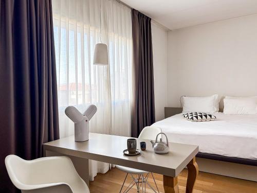 Postel nebo postele na pokoji v ubytování Le Nove Hotel