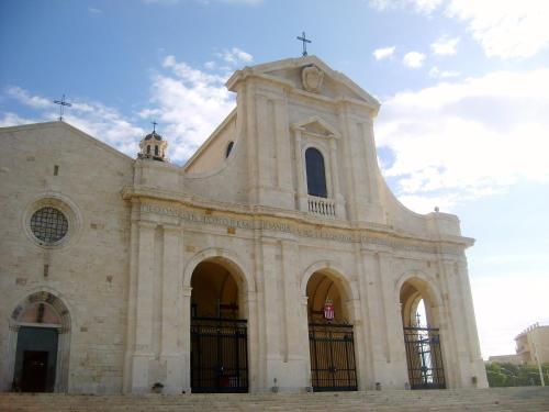 a church with a cross on the top of it at La casa di Cry in Cagliari