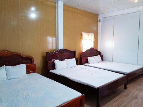 Postel nebo postele na pokoji v ubytování Homestay Nguyễn Hùng
