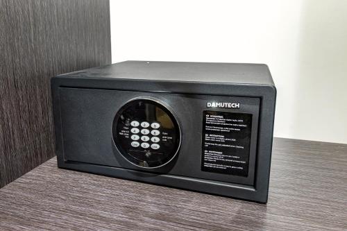 a microwave oven sitting on top of a table at Shymkent Grand Hotel in Shymkent