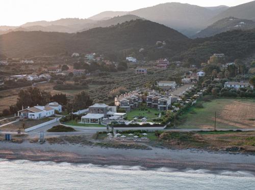 an aerial view of a town next to the water at Restia Suites Exclusive Resort -Adults Only in Almiros Beach