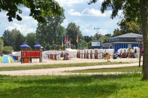 a park with a playground with a play equipment at Ferienwohnung ab zum Haff in Ueckermünde
