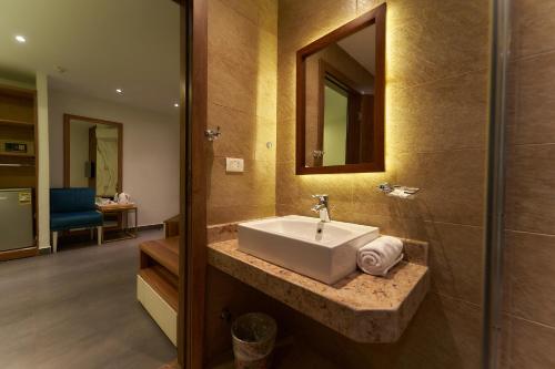 a bathroom with a sink and a mirror at Top pyramids hotel in Cairo