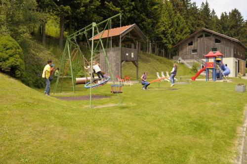 a group of children playing on a playground at Erlebnishof Reiner - Urlaub auf dem Bauernhof in Sankt Englmar