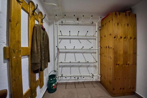 a walk in closet with shelves and a door at Miller Appartements in Sankt Veit im Pongau