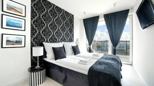 Postelja oz. postelje v sobi nastanitve Apartamenty Sun & Snow Westin House Resort