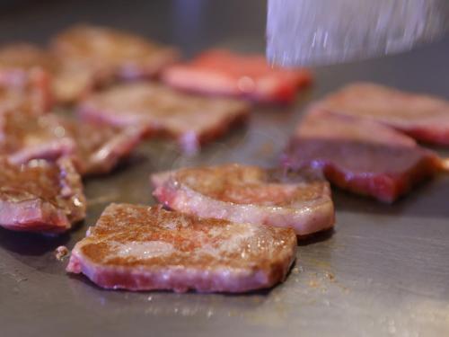 a bunch of pieces of meat on a pan at Dormy Inn Kawasaki Natural Hot Spring in Kawasaki