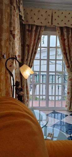 a bedroom with a bed and a glass table at piso en arenas de velez malaga in Málaga