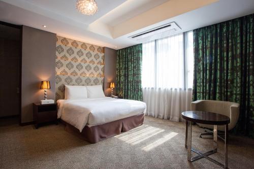 Postel nebo postele na pokoji v ubytování Hotel Pharos