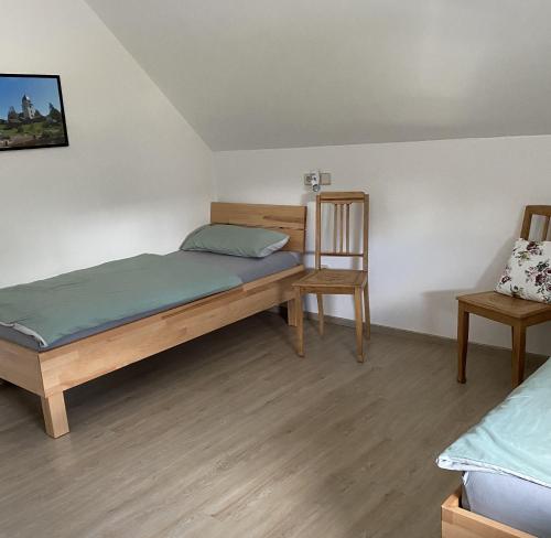 Tempat tidur dalam kamar di Ferienwohnung II