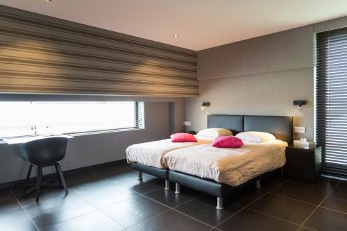 Hotel Den Bergにあるベッド
