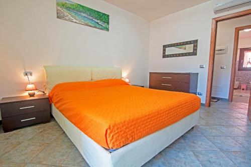 Postel nebo postele na pokoji v ubytování Il Pescatore - Marina di Campo