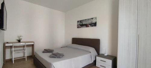 a small bedroom with a bed and a desk at G21 Guest House in Rome