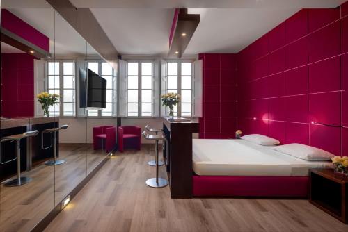 Postel nebo postele na pokoji v ubytování UNA HOTELS Vittoria Firenze