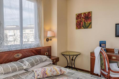 Postel nebo postele na pokoji v ubytování Vintage Hotel Tornese - Business & Events