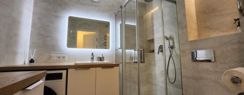 a bathroom with a shower and a sink at Golden in Šiauliai