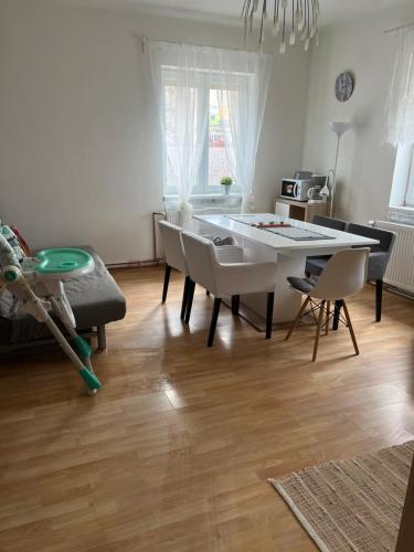 a living room with a dining table and chairs at Ubytování Mája in Liberec