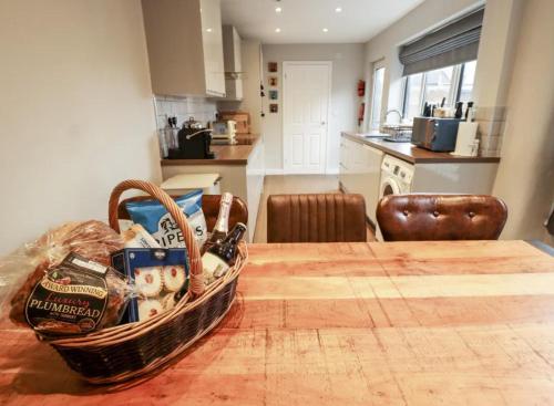 a basket sitting on a table in a kitchen at Luxury Lincoln Home with hot tub sleeps 8 in Lincoln