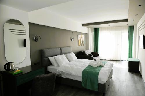 Postel nebo postele na pokoji v ubytování Aybek Ratio Hotel