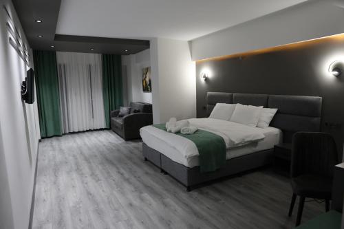 Postel nebo postele na pokoji v ubytování Aybek Ratio Hotel