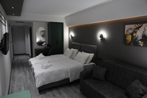 Postel nebo postele na pokoji v ubytování Aybek Ratio Hotel