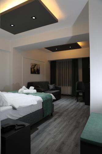 Postel nebo postele na pokoji v ubytování Aybek Ratio Hotel