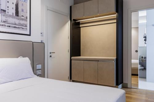 Ένα ή περισσότερα κρεβάτια σε δωμάτιο στο Mh Florence Hotel & Spa
