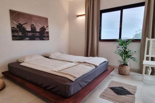 Ένα ή περισσότερα κρεβάτια σε δωμάτιο στο Villa Osaya