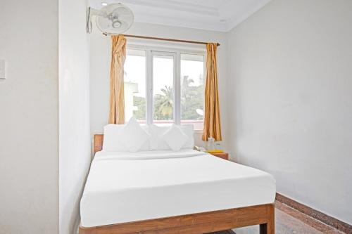 Krevet ili kreveti u jedinici u okviru objekta OYO Mount Alagar Residency