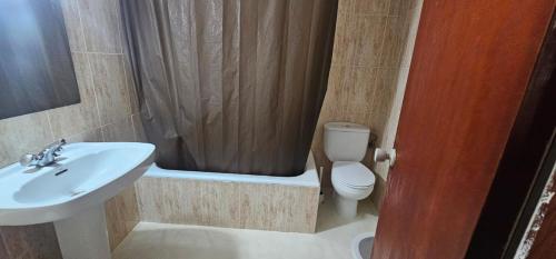 a bathroom with a sink and a toilet and a shower at Pensión España 2 Estrellas Cehegin in Cehegín