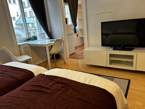 Televízia a/alebo spoločenská miestnosť v ubytovaní Metropolitan Haven in Stockholm City! 911