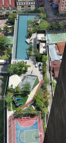 an overhead view of a swimming pool in a city at Urban Suites - Dolphin's Home in Jelutong