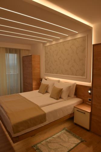 Tempat tidur dalam kamar di Hotel Zeleni Grad