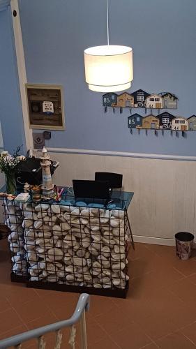 a table in a room with a blue wall at Hotel Canarco in Viareggio