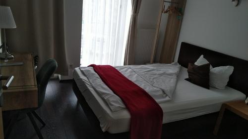 Voodi või voodid majutusasutuse Hotel Gemini toas
