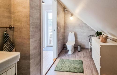 a small bathroom with a toilet and a sink at Awesome Apartment In Ljungskile With Wifi in Ljungskile