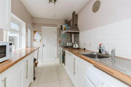 a kitchen with a sink and a counter top at Affordable and comfort apartment in Ibadan