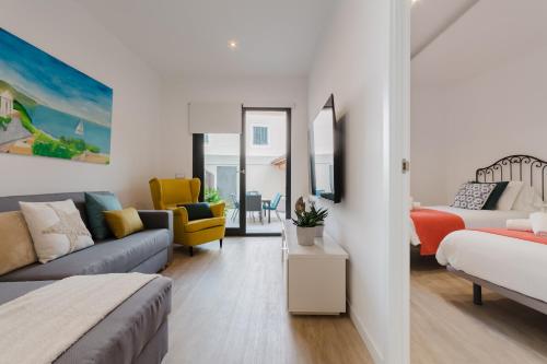 a living room with a couch and a bed at Ca nAntonia in Lloseta