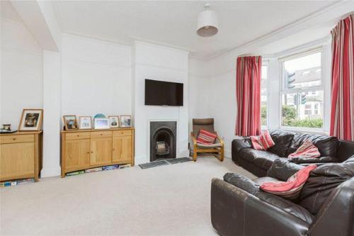 a living room with a couch and a fireplace at Affordable and comfort apartment in Ibadan