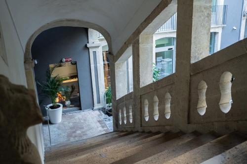 an entrance to a building with an archway at Palazzo Sangiorgio in Catania