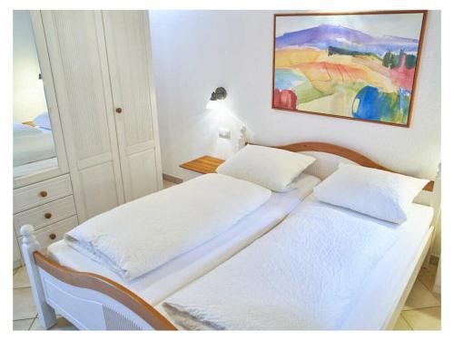 A bed or beds in a room at 2 holiday guesthouse Posthof