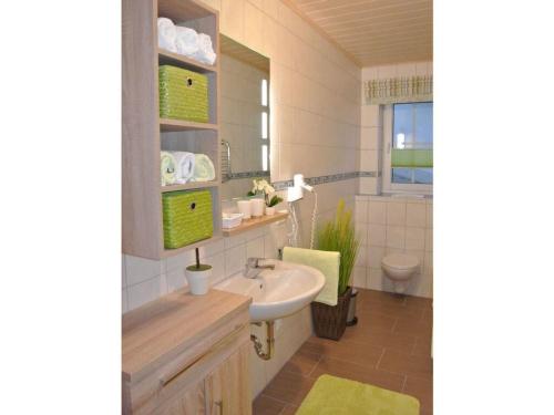 a bathroom with a sink and a toilet at Kiesenberg 9 Modern retreat in Thanstein