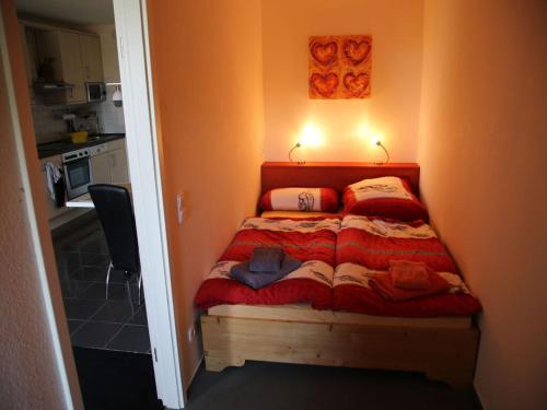 En eller flere senge i et værelse på Ostseeliebe Comfortable holiday residence